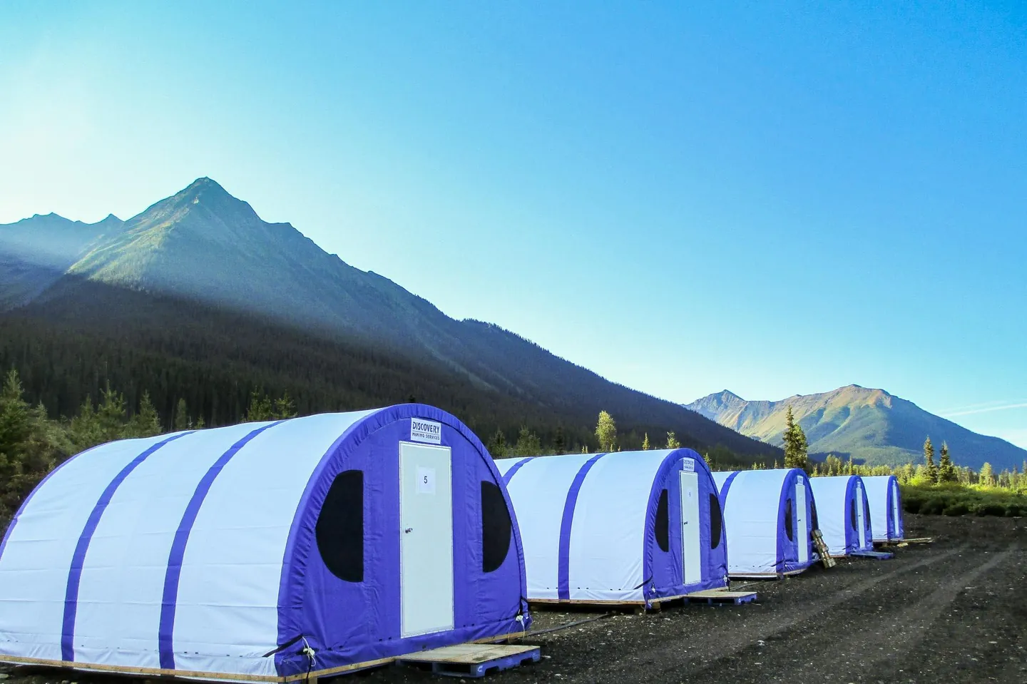 Temporary camp structures at a remote mountain site